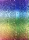 Water drops on glass rainbow