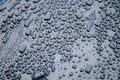 Water drops on a gray metal surface.Water drops on metal background. Royalty Free Stock Photo