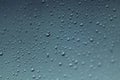 Water drops on grey window glass on rainy day Royalty Free Stock Photo