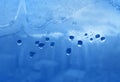 Water drops, ice pattern and sunlight on window glass Royalty Free Stock Photo