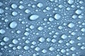 Water drops on light background, top view, close-up, macro. Great background with natural water drops and natural light Royalty Free Stock Photo