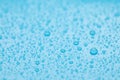 Water drops on light blue background, closeup Royalty Free Stock Photo