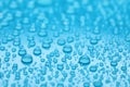 Water drops on light blue background, closeup Royalty Free Stock Photo