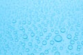 Water drops on light blue background, closeup view Royalty Free Stock Photo