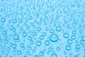 Water drops on light blue background, closeup Royalty Free Stock Photo