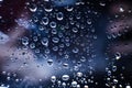 Water drops in macro in a dark violet background. Water drops in macro. Royalty Free Stock Photo
