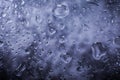 Water drops in macro in a dark violet background. Water drops in macro. Royalty Free Stock Photo