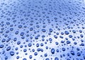 Water drops on metal surface as an abstract background. Royalty Free Stock Photo