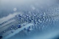 Water drops on the metallic surface of a blue car Royalty Free Stock Photo