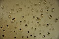 Water drops on the mirror, light brown background Royalty Free Stock Photo