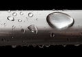 Water drops on misted metal tube