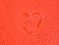 Water drops on red background with outlined outline hearts. Close-up