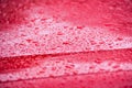 Water drops on red background - rain drops on car Royalty Free Stock Photo