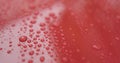 Water drops on red car with hydrophobic coating