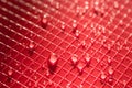 Water drops on red plastic background texture Royalty Free Stock Photo
