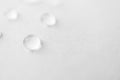 Water drops with selective focus on white background, macro. Concept moisturizing close-up. Aqua Royalty Free Stock Photo