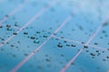 Water drops in a shiny metallic surface with table re Royalty Free Stock Photo