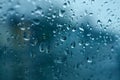 Water drops on the side window of the car. View from the inside of the car during the rain on the evening city street Royalty Free Stock Photo