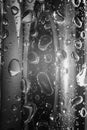 Water drops on silver metallic surface close up wallpaper. Monochrome condensation highlight reflection Royalty Free Stock Photo
