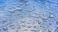 Water drops on smooth surface in perspective, macro