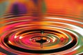 Water drops splash. Red and yellow ripples, reflections on surface Royalty Free Stock Photo