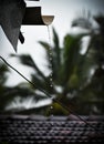 Water drops splashing from the rain water-outlet pipe. Royalty Free Stock Photo