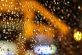 Water drops on a transparent glass surface with blurred bokeh background Royalty Free Stock Photo