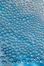 water drops on the transparent surface of a glass bottle on a blue background Royalty Free Stock Photo