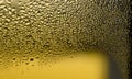 Water drops on the wet glass. Abstract background. Yellow color Royalty Free Stock Photo
