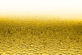 Water drops on the wet glass. Abstract beer background. Yellow color Royalty Free Stock Photo