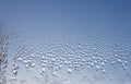 Water drops on the wet window glass. Abstract background. Blue color Royalty Free Stock Photo