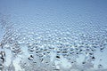 Water drops on the wet window glass. Abstract background. Blue color Royalty Free Stock Photo