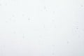 Water drops on white surface background Royalty Free Stock Photo