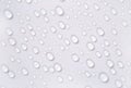 Water drops on the white surface Royalty Free Stock Photo