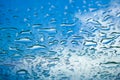 Water drops window glass blue sky perspective Royalty Free Stock Photo