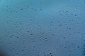 Water drops on window glass after rain. Macro of raindrops as abstract background with shallow depth of field. Rainy weather. Royalty Free Stock Photo