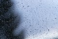 Water drops on window glass after rain. Macro of raindrops as abstract background with shallow depth of field. Rainy weather. Royalty Free Stock Photo