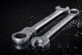 Water drops on workshop wrenches. Wet tools used in a machine shop Royalty Free Stock Photo
