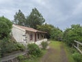 Water duct levada maintenance house Casa del Monte at mysterious Laurel forest Laurisilva, lush subtropical rainforest