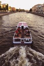 Water excursions along on the boat the rivers and canals by historical places of St. Petersburg, Russia Royalty Free Stock Photo