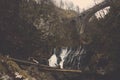 Water fall with small dam under brick bridge Royalty Free Stock Photo