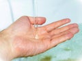 Water falling into hand Royalty Free Stock Photo