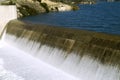 Water falling over dam during rainy season Royalty Free Stock Photo