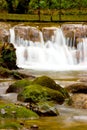 Water falling over red rocks Royalty Free Stock Photo