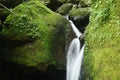 water falling on river pass rock and stone at Pha Gnam Gnon waterfall in Thailand Royalty Free Stock Photo