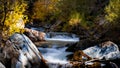 Water falls on Big Cottonwood creek in Utah during autumn time