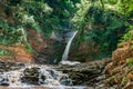 Water falls from a cliff and flows beautifully over the rocks Royalty Free Stock Photo