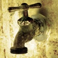 Water Faucet on Old Worn Wall Royalty Free Stock Photo