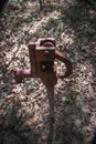 A water faucet standing alone in the forest park.