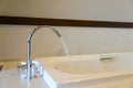 Water from faucet to bathtub Royalty Free Stock Photo